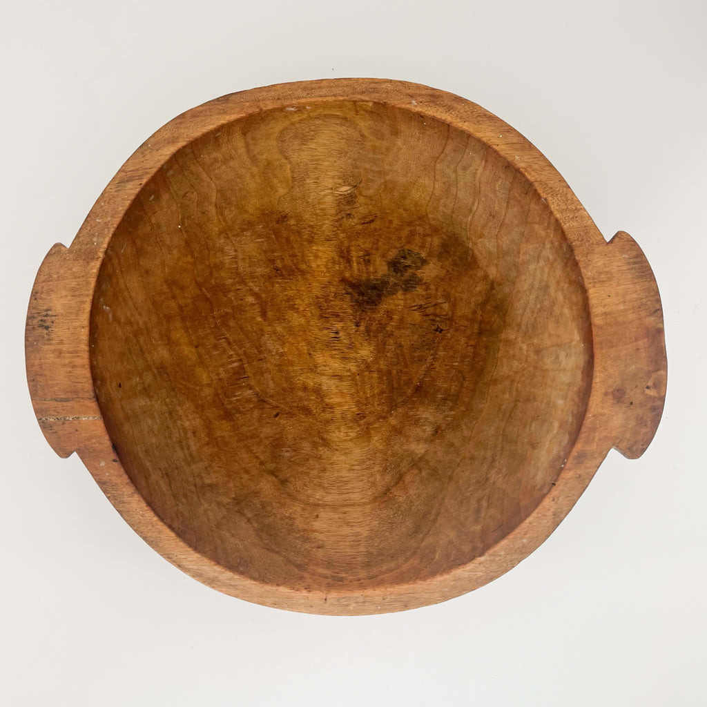 Antique round wooden dough bowl hand-carved from solid brown wood circa 1920, featuring rustic patina and authentic farmhouse charm.