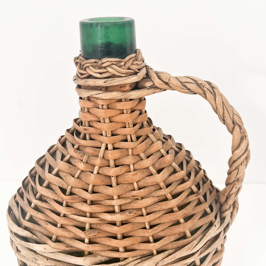Antique-style European wine demijohn with beautifully textured willow wicker weaving, natural brown colour variations and timeless rustic character.