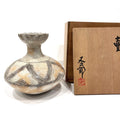 Japanese ceramic vase with rounded body
