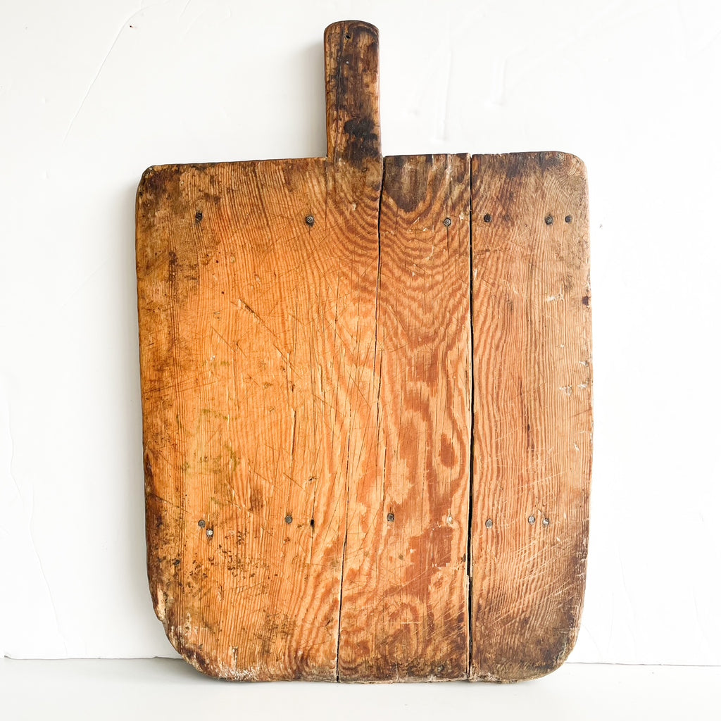Rustic farmhouse charcuterie board with small back legs