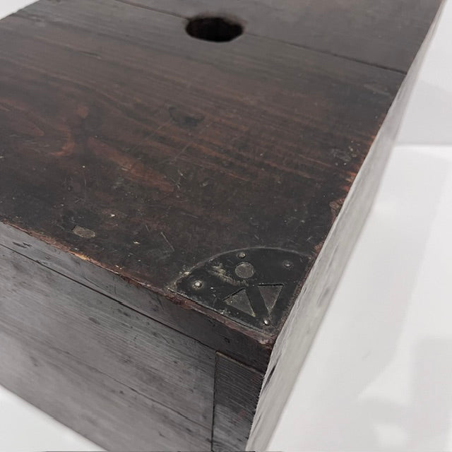 Close-up of hand-forged iron fittings on antique Japanese merchant cash box