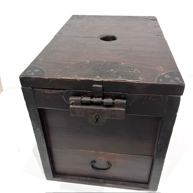 Wooden top of antique Zenibako showing the original circular coin slot